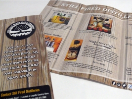 A tri-fold brochure designed for Still Fired Distilleries. This brochure was made to showcase their products and where to purchase them,  as well as tell a little bit about their background story.